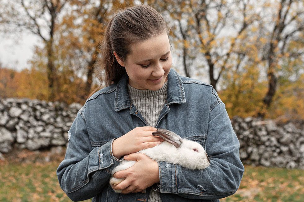 woman caring rabbit